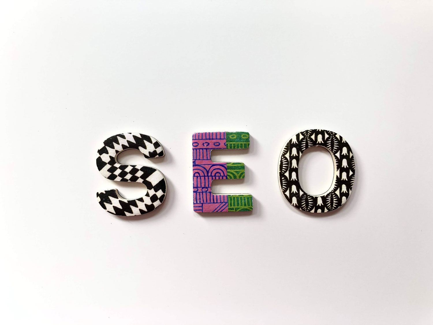 SEO graphic with each letter in the word SEO styled differently